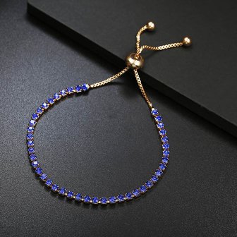 Armband goudkleurig met 1 rij blauwe strass