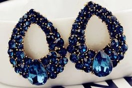 Goudkleurige oorbellen blauwe strass